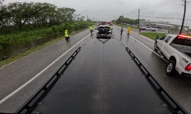 Flatbed tow truck loaded with a commercial vehicle in Asheville NC