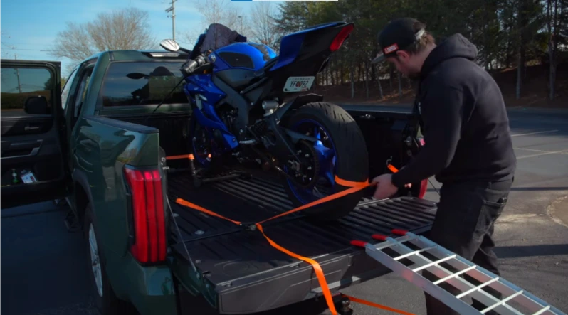 Motorcycle being loaded onto a flatbed tow truck on Cane Creek Road east of Fletcher NC