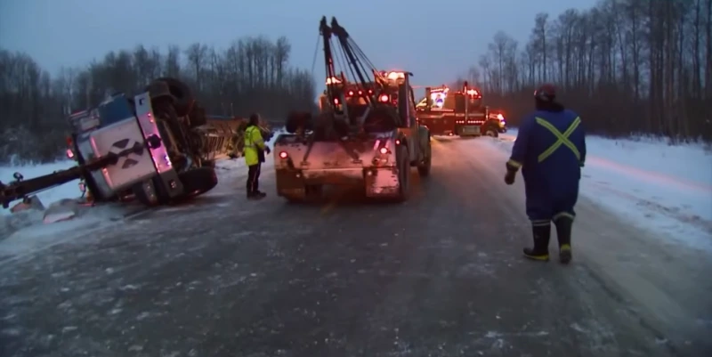 Heavy duty wrecker truck recovering a disabled commercial vehicle on I-40 near Asheville NC