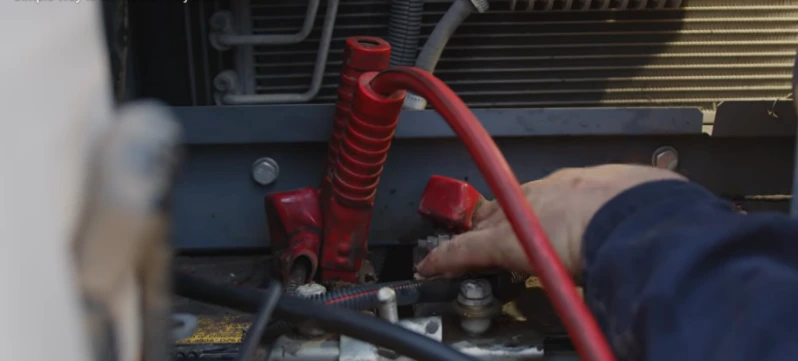 Battery jump start service for a vehicle in a Skyland NC driveway on US-25 South before the.