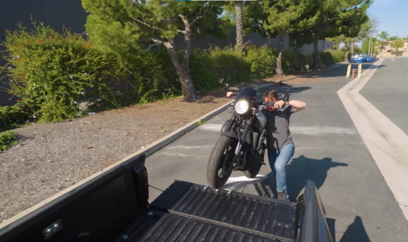Motorcycle being loaded onto a flatbed tow truck on Reems Creek Road north of Weaverville NC