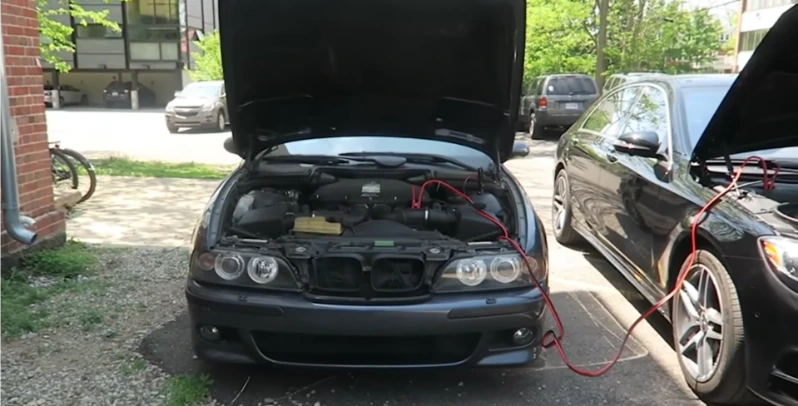 Battery jump start service at an Elk Mountain Scenic Highway trailhead parking area in Woodfin NC